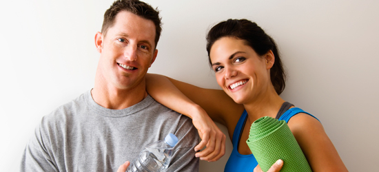 A healthy and happy male and female employee that are smiling